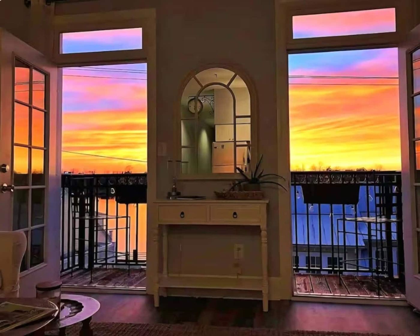 Riverside Suite balcony at sunset over the Cape Fear River